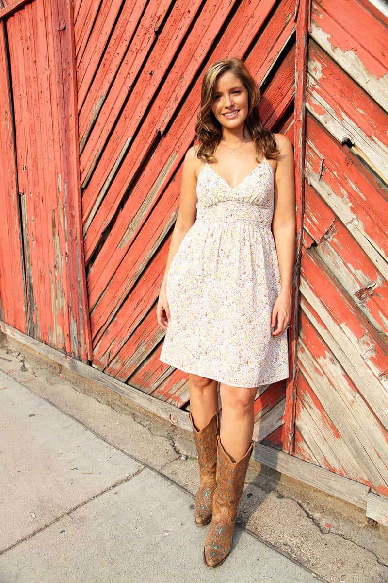 Beautiful cowgirl wearing floral dress