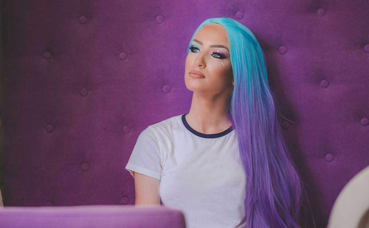 Beautiful woman with blue-purple hair