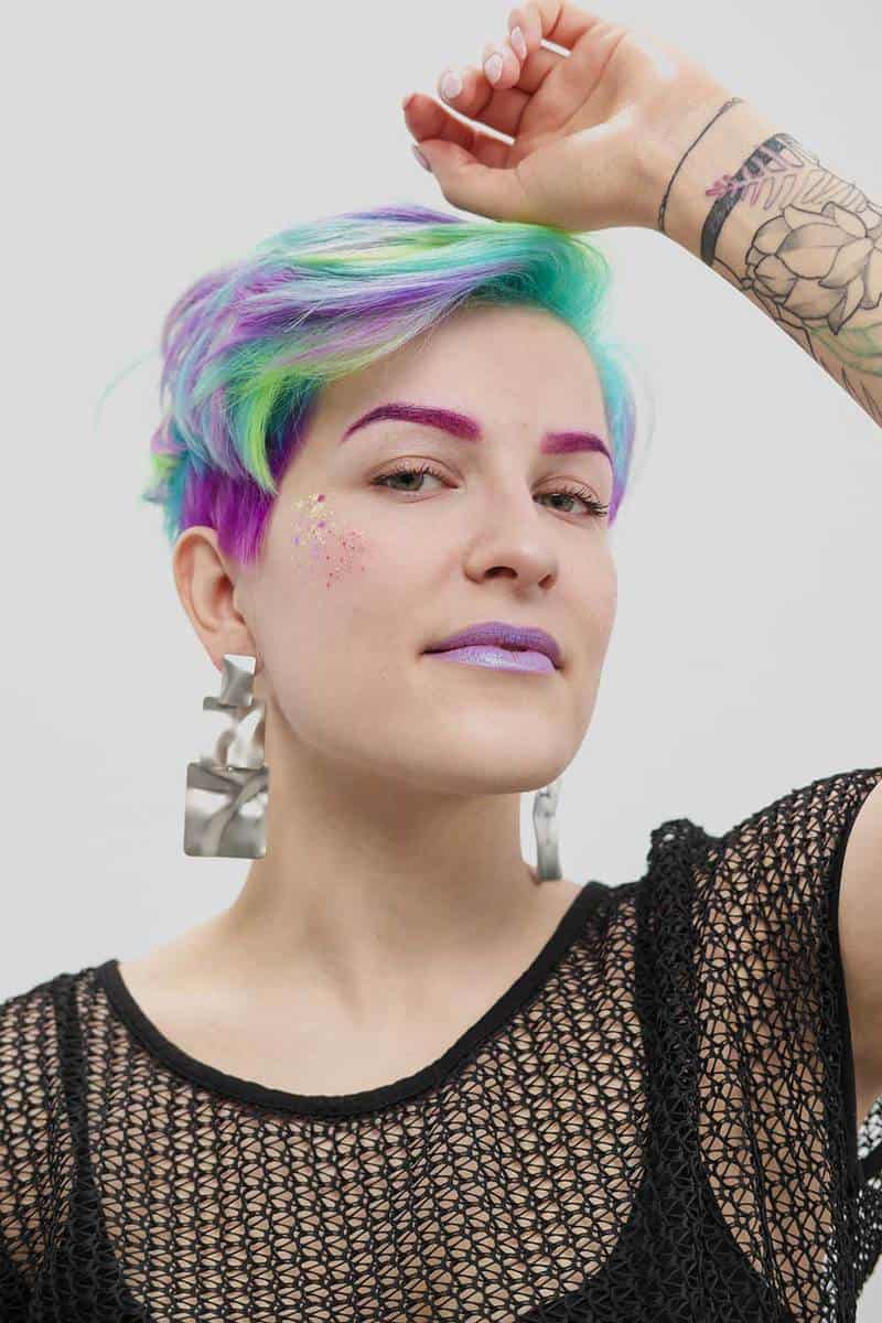 Beautiful woman with stylish colored hair