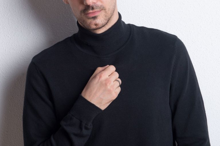 Portrait of a young handsome man in black turtleneck in a studio, How-to-Wear-a-Turtleneck-[An-Illustrated-Guide], How-to-Wear-a-Turtleneck-[An-Illustrated-Guide]