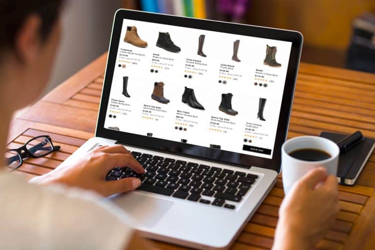 Man searching for leather boots online with his macbook, Where-to-Buy-Leather-Boots-[Top-40-Online-Stores], a girl browsing for a leather boots, Where to Buy Leather Boots? [Top 40 Online Stores]