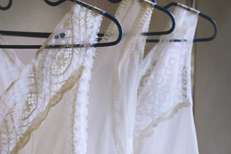 Lace white tank tops on hangers