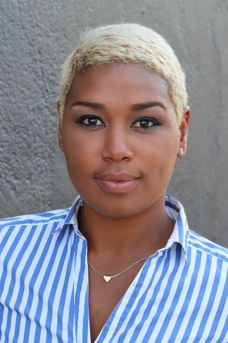 Beautiful young African American woman with short dyed blonde hair