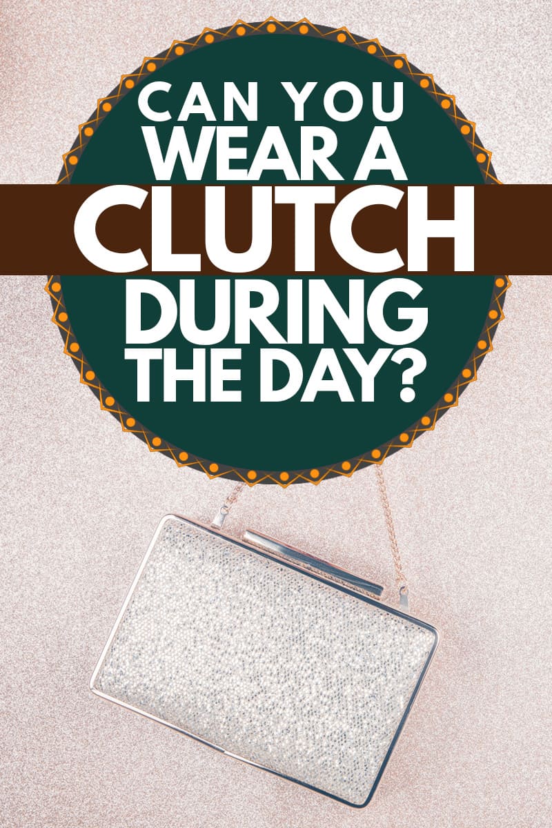 A woman with red colored nails and holding her clutch handbag, Can You Wear a Clutch During the Day?