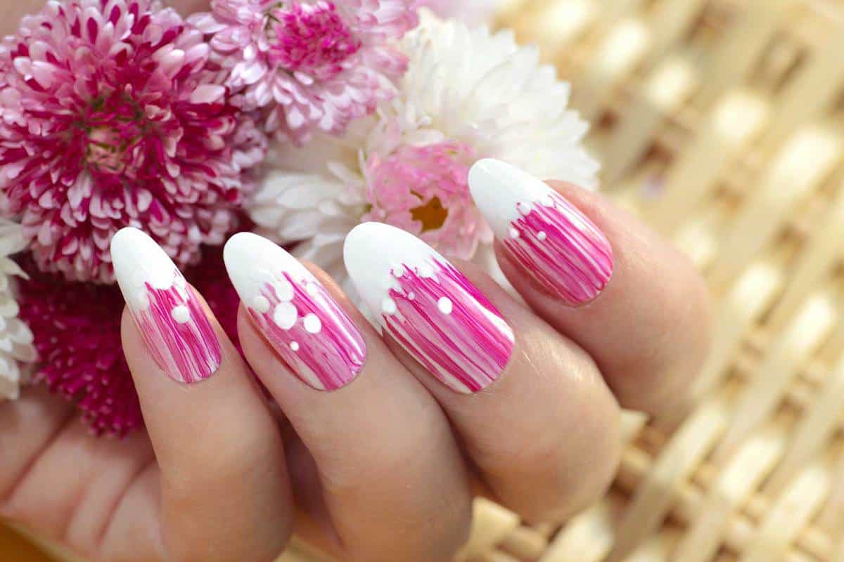 French oval manicure with a striped gradient in pink tones