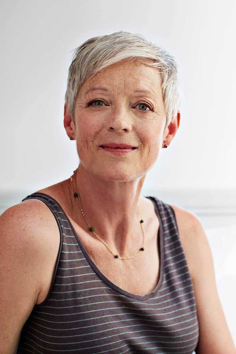 Portrait of a smiling mature woman with short hair at home