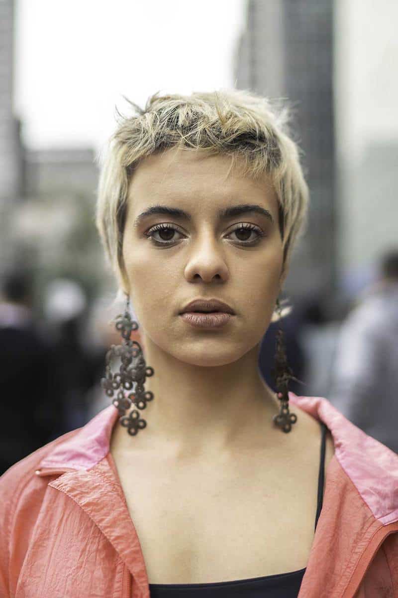 Portrait of a young latin woman with short hair in the city