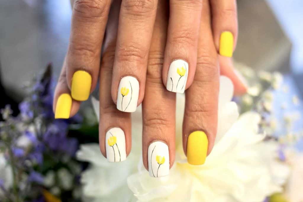 Summer inspired yellow flower nail art design