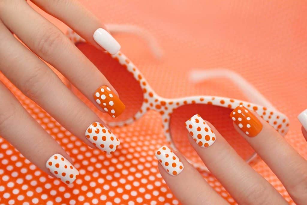 Sunny orange manicure with dots