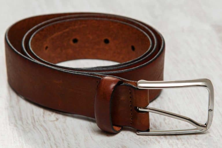 Close up photo of a leather brown belt, What Can I Use Instead of a Belt? [5 Belt Alternatives]