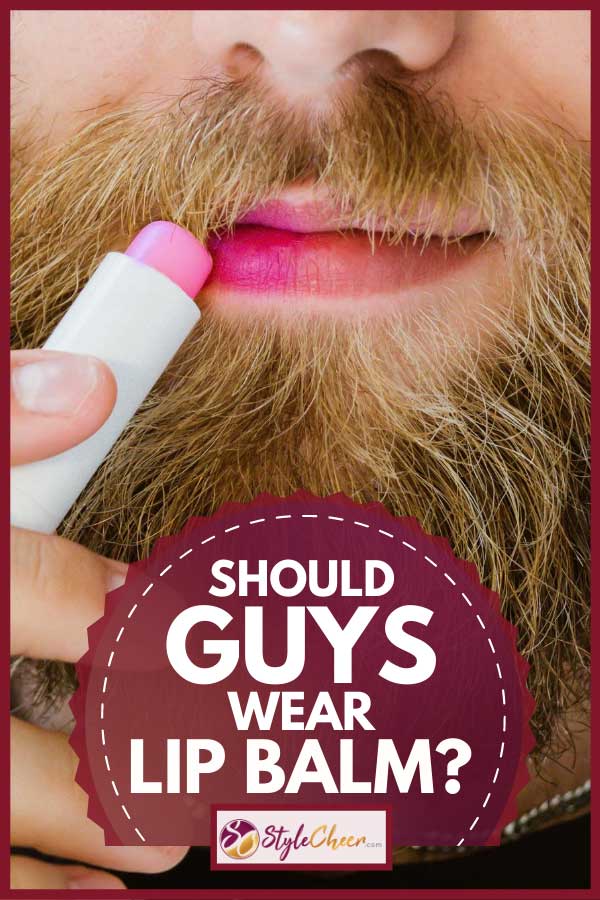 Bearded man applying colorful pink lip balm on his lips, Should Guys Wear Lip Balm?