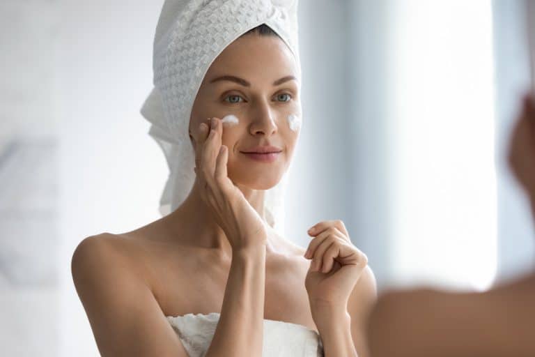 An attractive woman putting on moisturizer on her face, Is It Bad To Use Moisturizer Every Day?