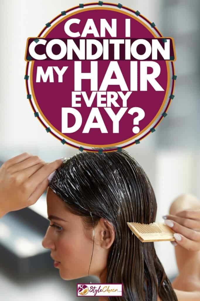 A woman putting on conditioner hair on her hair and combing it to spread it evenly throughout her hair, Can I Condition My Hair Every Day?