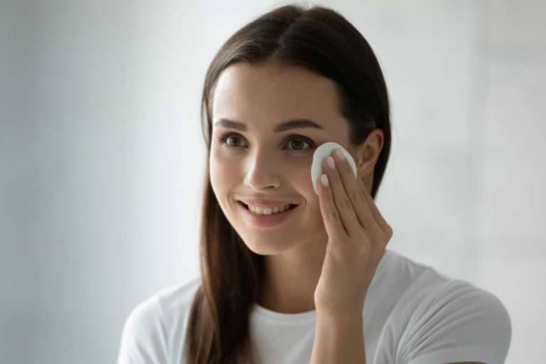 Smiling millennial girl applying toner on her face, Can You Use Glycolic Acid Toner Everyday?