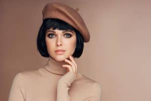Woman with a French Bob hairstyle with a beret on her head, Does A French Bob Hairstyle Have Layers?
