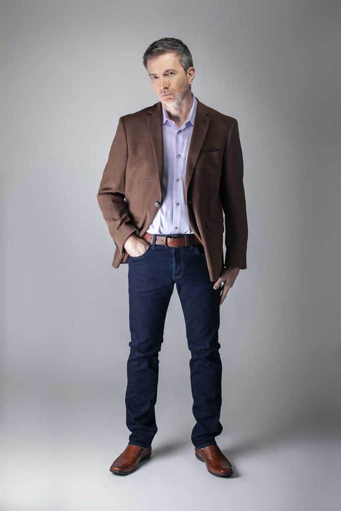 Bearded middle-aged fashion model posing with business casual style outfit