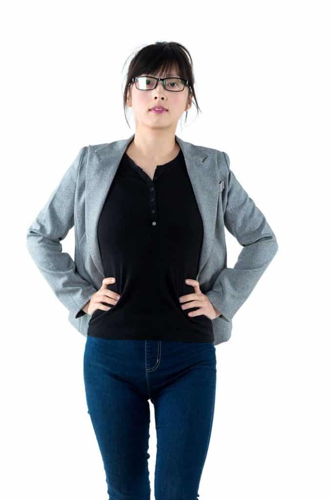 Businesswoman with arms akimbo