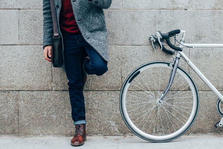 Elegant man with a bicycle using a smart phone in the city, How To Make Straight Leg Pants Skinny (Even Without Sewing)