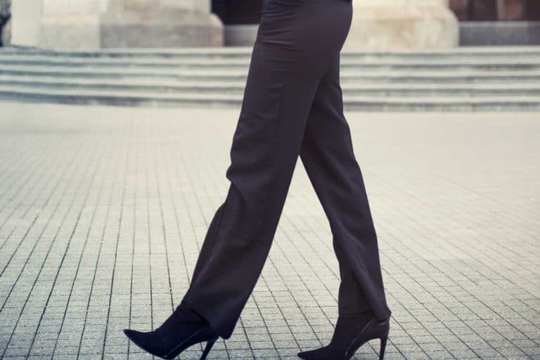 Fashionable business woman wearing straight leg pants walking on the city street, How Long Should Straight-Leg Pants Be?