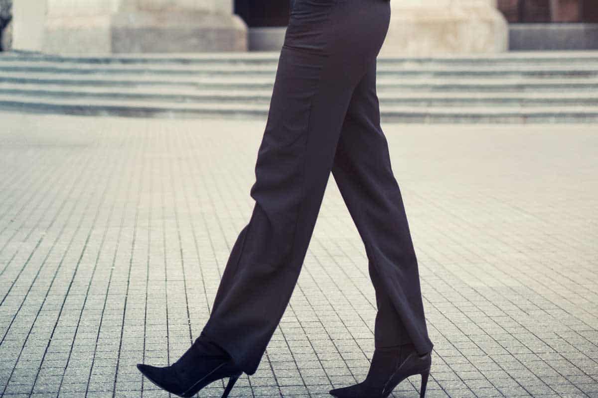 Woman in straight-leg pants walking on the street