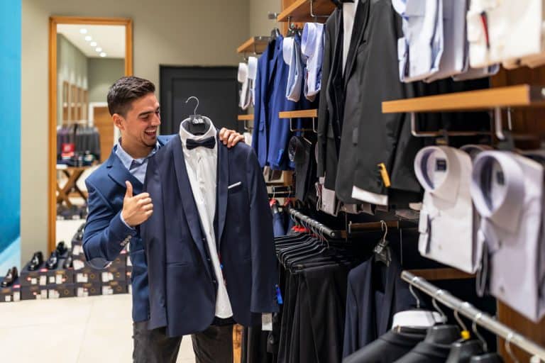 A portrait of a man shopping at a clothing store, 31 Types of Coats And Jackets You Should Know