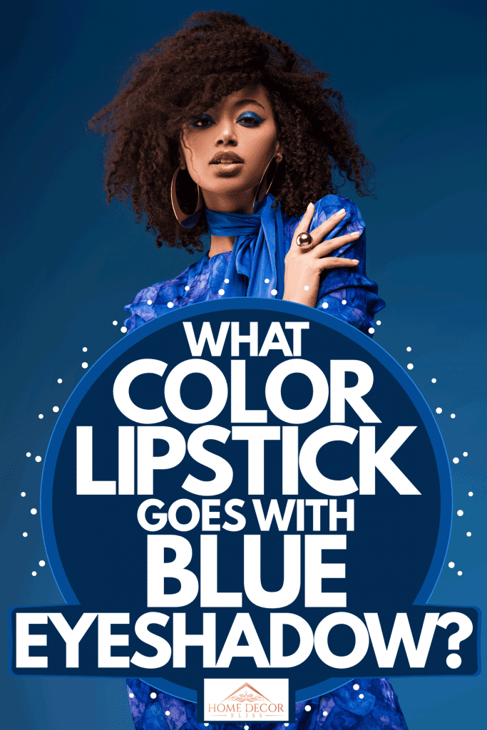 A beautiful woman wearing a beautiful blue dress and gorgeous eyeshadow while standing on a blue background, What Color Lipstick Goes With Blue Eyeshadow?