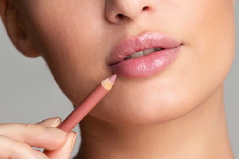 Woman drawing lips with nude pink lip liner, Do You Really Need Lip Liner?