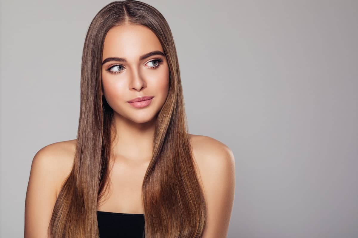 Young woman with beautiful brown middle part hairstyle