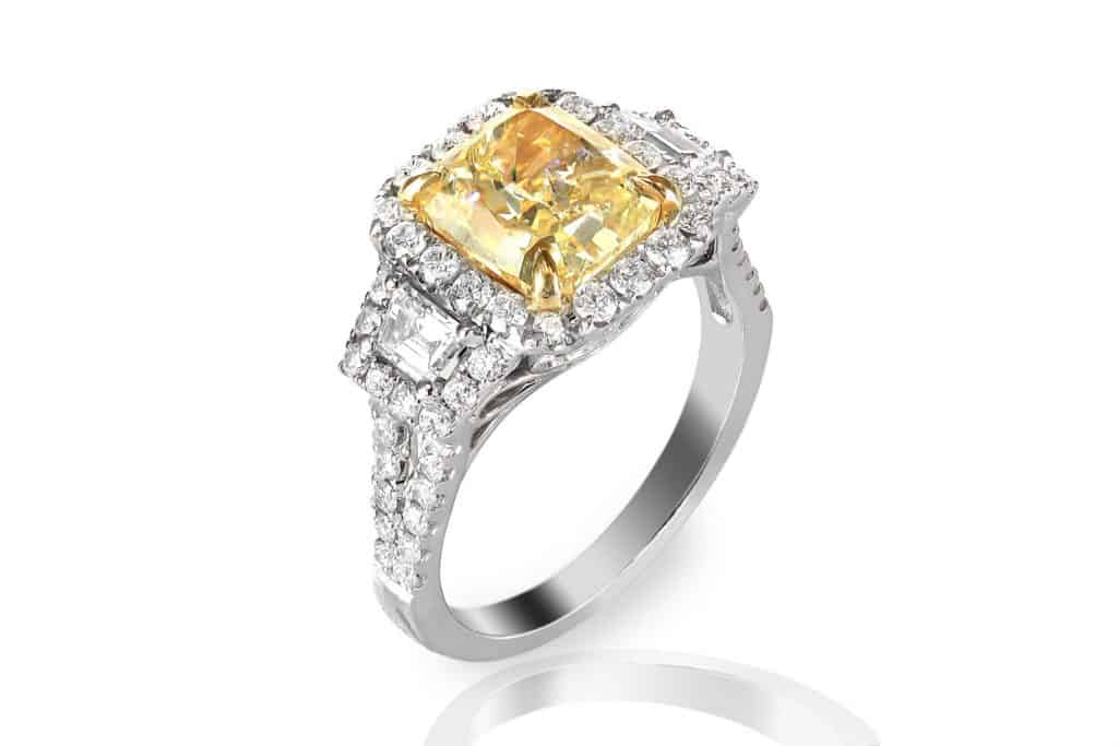 A diamond encrusted yellow sapphire ring