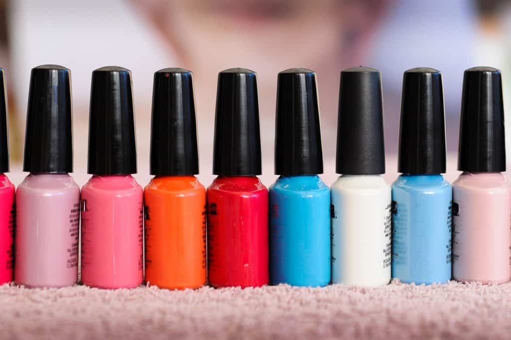 A letterbox image capturing a row of shellac nail polish bottles in a row