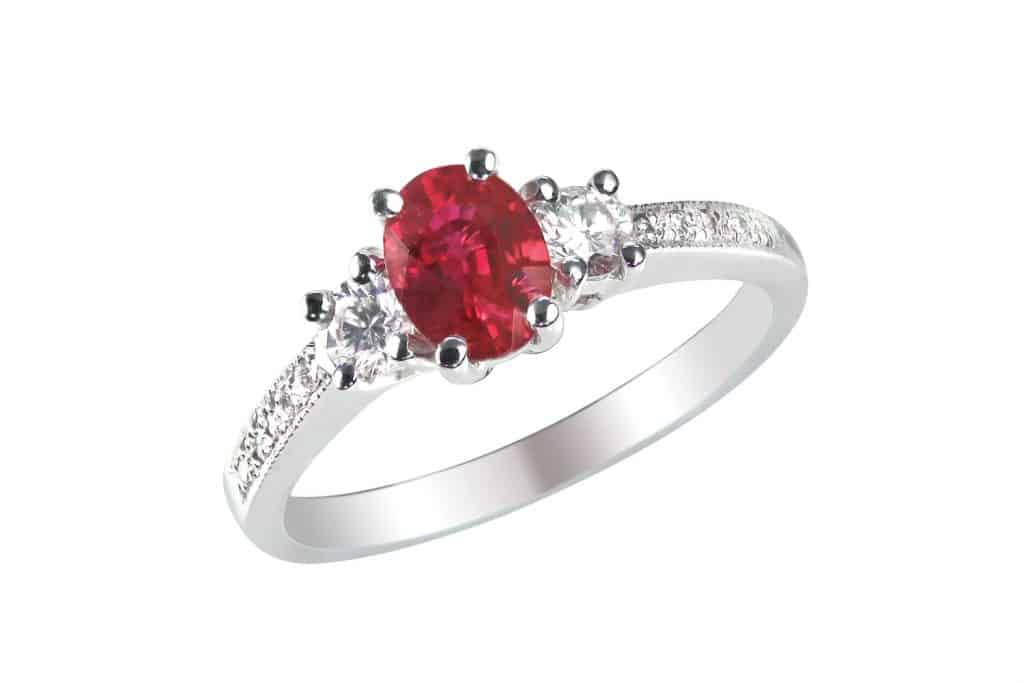 A silver ruby ring on a white background