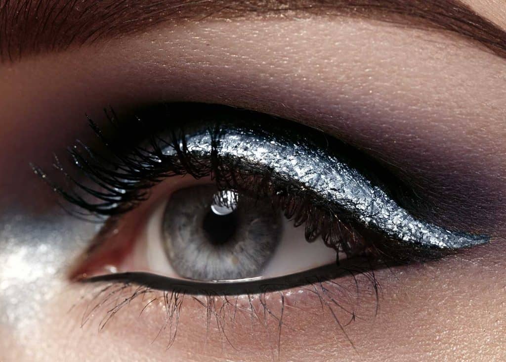 Beautiful macro shot of female eye with ceremonial makeup