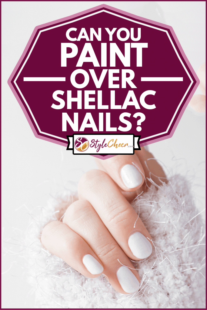 Beautiful groomed woman's hands with white nails on a light gray background, Can You Paint Over Shellac Nails?