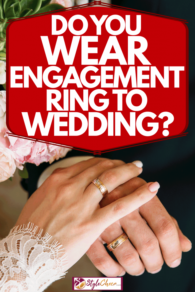 Newly wed couple holding hands showing their engagement rings on their hands, Do You Wear Engagement Ring To Wedding?