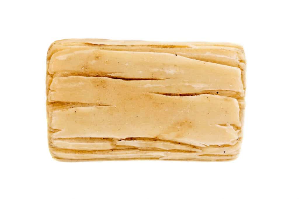 Dry bar of soap in a white background