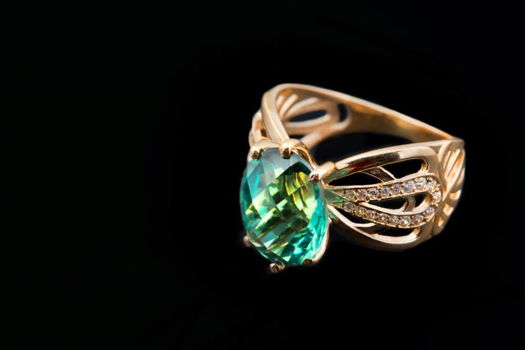 Elegant female jewelry with emerald