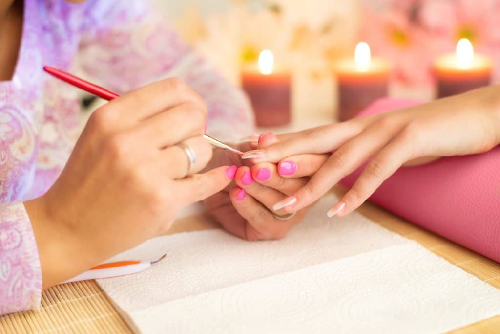 Manicure process in professional beauty salon, the making of artificial nails