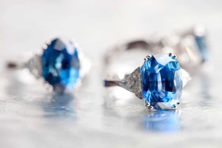 Three expensive perfectly cut blue diamond rings on a gray background, 6 Best Gemstones for Engagement Rings