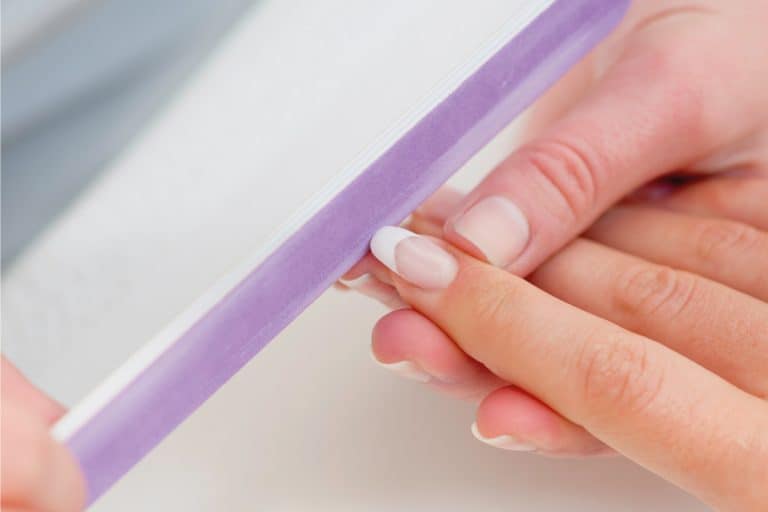 Using nail file on shellac nails in salon, How Much Do Shellac Nails Cost?