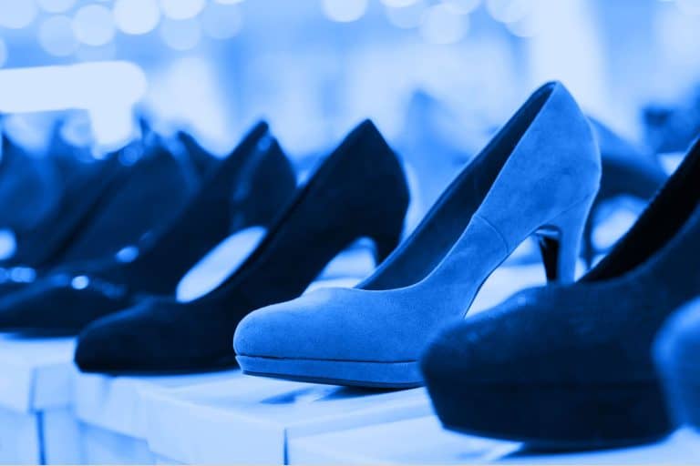 Women's navy blue high heeled shoes on display at a fashion store, What Color Shoes Goes With Everything?