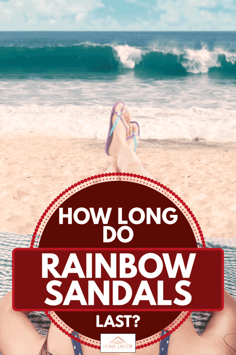 Model lying on a beach chair facing the sea wearing rainbow sandals, How Long Do Rainbow Sandals Last?