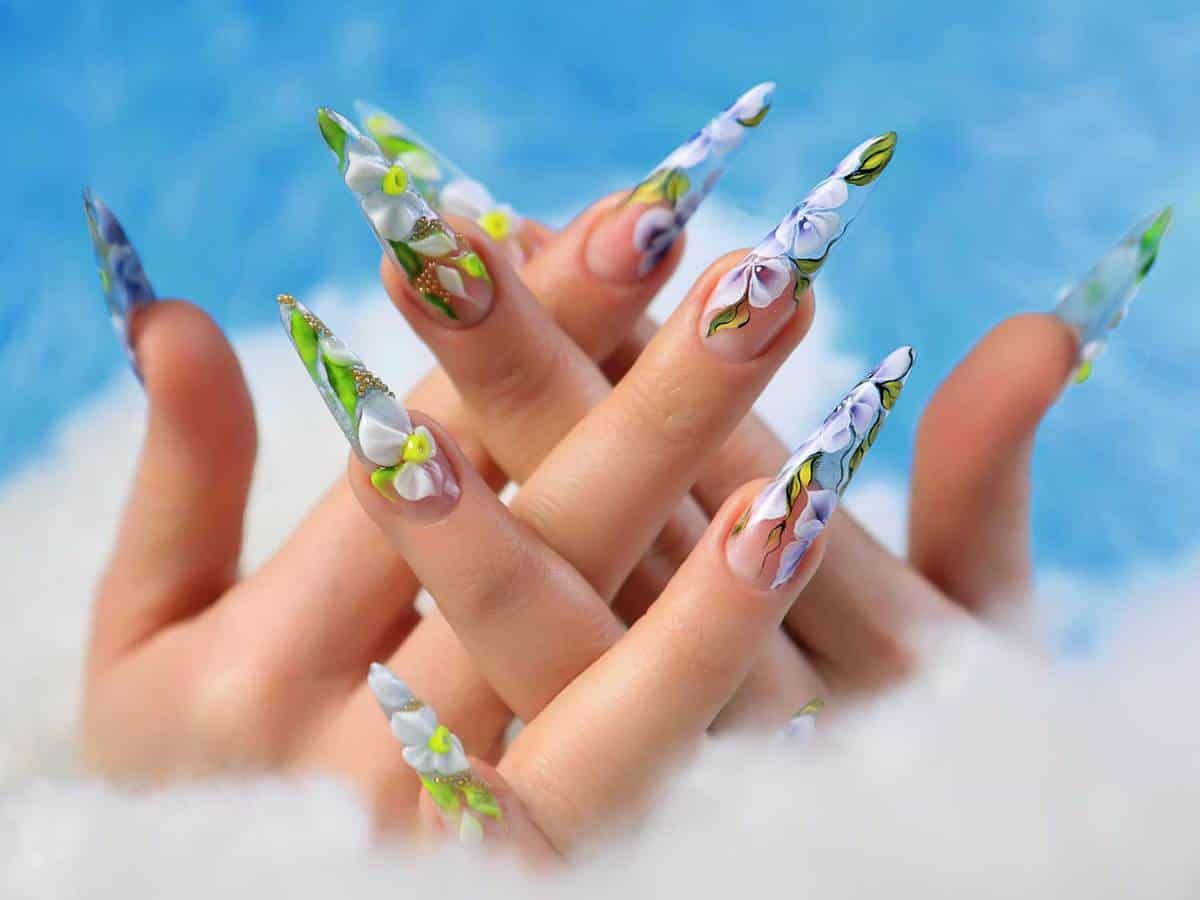 Acrylic flowers on woman's nails