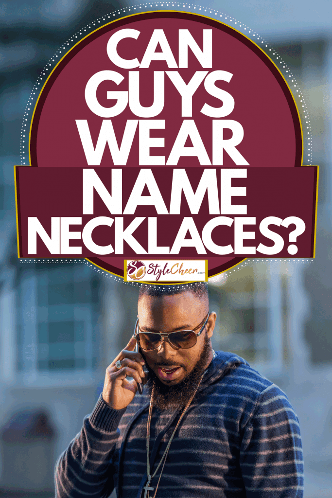 A well dressed man wearing a stripped shirt and a long golden necklace, Can Guys Wear Name Necklaces?