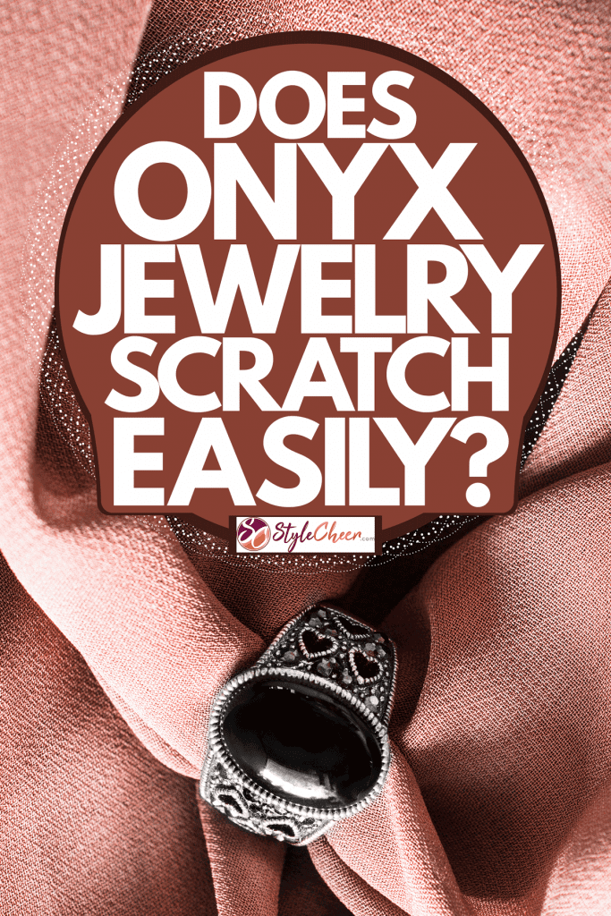 A gorgeous silver onyx ring on a pink cloth, Does Onyx Jewelry Scratch Easily?
