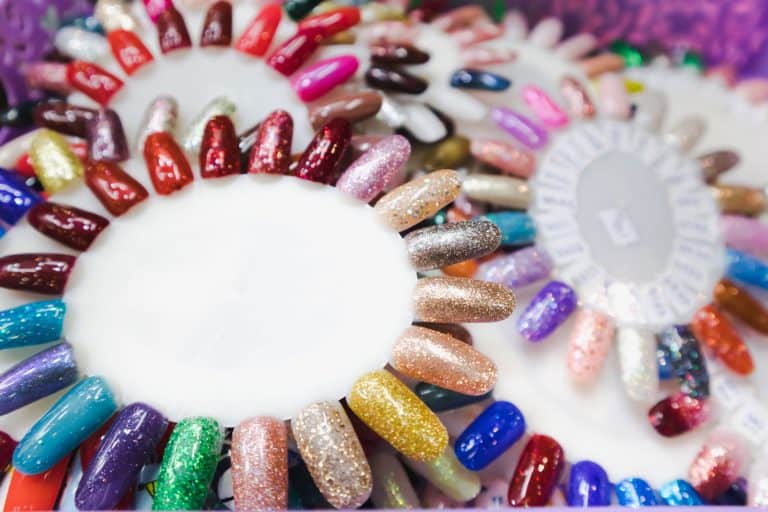 Fake Nail polish in different fashion color wheel, How Much Does It Cost To Get Fake Nails? [Breakdown By Nail Type]