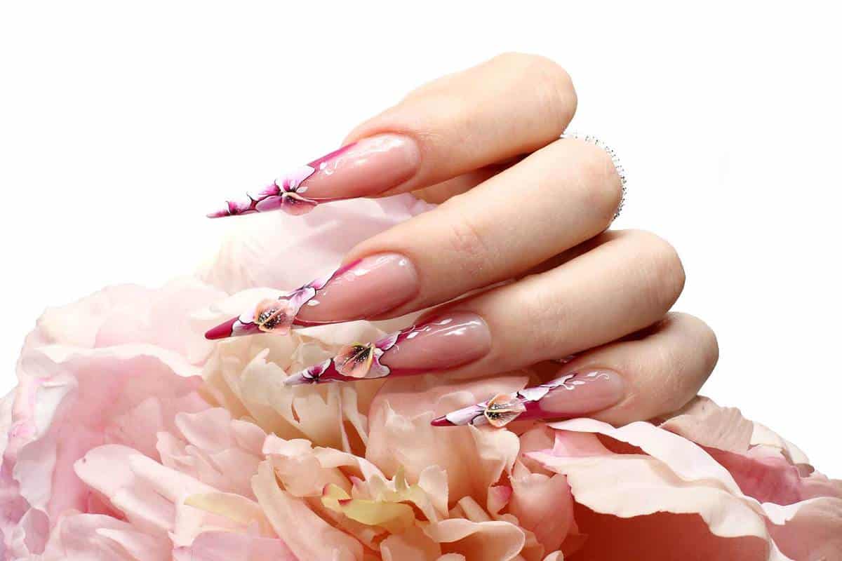Manicured acrylic nails with floral designs