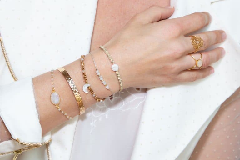A woman wearing different kinds of bangle bracelets on right hand, How To Open A Bangle Bracelet