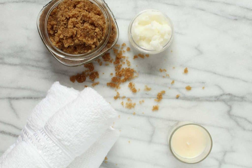 Above view of homemade brown sugar scrub and ingredients
