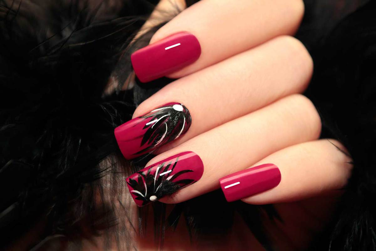 Nails painted with burgundy manicure