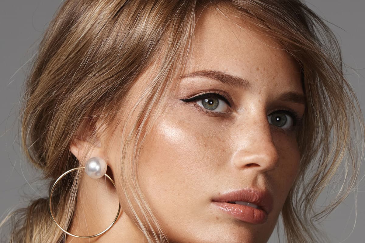 Portrait of beautiful blonde natural woman with earrings, What Color Eye Makeup Looks Best For Blue Eyes And Blonde Hair?